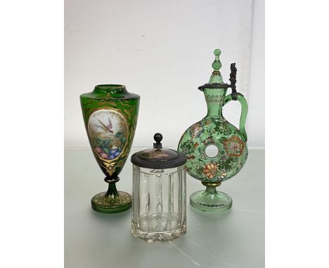 A group of Bohemian glass comprising: a green glass ring decanter, enamel painted with scrolling flowers and with hinged spir