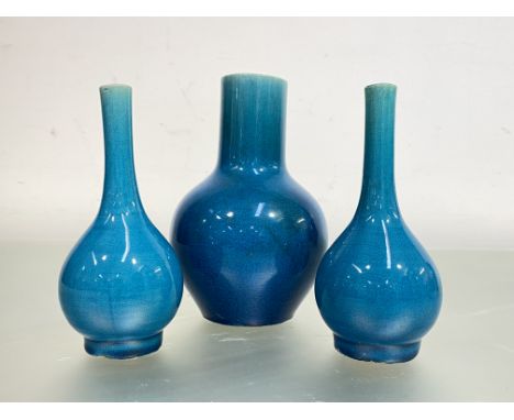 A Chinese turquoise glazed porcelain vase of bottle shape, with unglazed base; together with a pair of small turquoise glazed