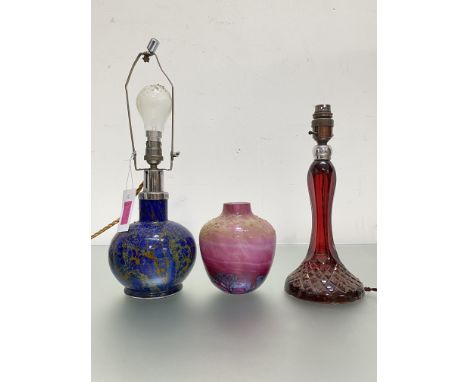 A group of studio and other glass comprising: a pink cased glass vase with blue inclusions; a blue cased glass lamp base with