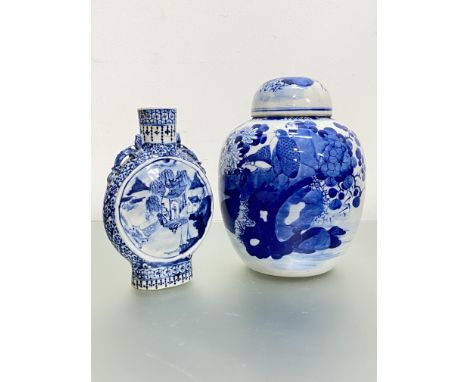 A Chinese blue and white porcelain baluster jar and (associated) cover, painted with birds by a fence with flowers and foliag