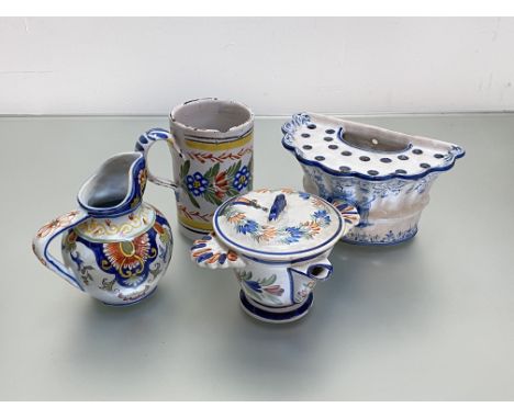 A group of French faience including Quimper comprising: a bough pot, decorated in blue and white with an armorial; a Quimper 