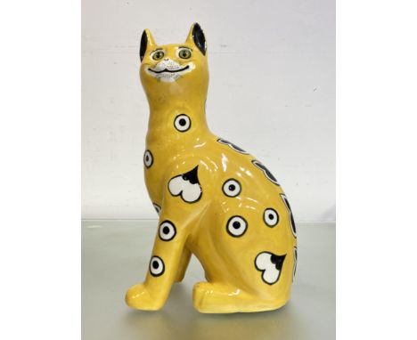 A Griselda Hill Pottery (Wemyss) model of a Galle style cat, glazed in yellow and with glass eyes, painted mark. 33cm