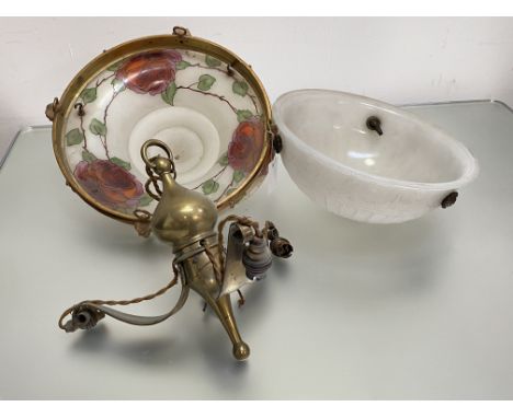 Two early 20th century glass ceiling lights: the first of bowl form, in moulded opaque glass, decorated with a flowerhead and