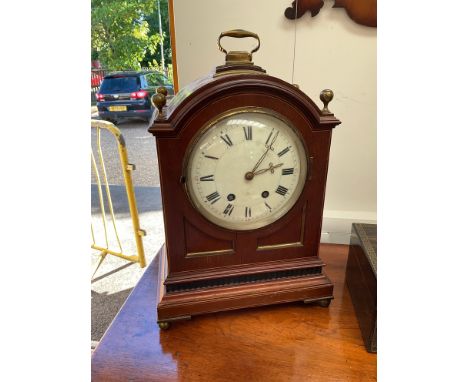 An Edwardian mahogany cased bracket clock in the Regency style, twin train movement, Roman dial, brass finials, 44.5cm tall 