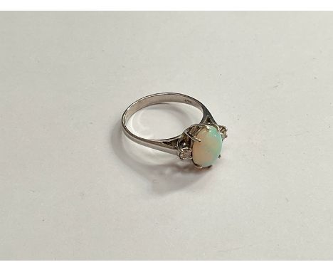 An 18ct white gold opal and diamond ring. Size K, 2.3g 