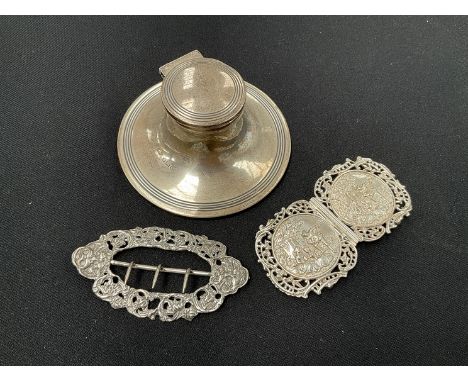 A silver capstan inkwell and two silver buckles (3) 