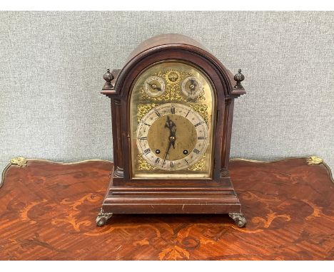 An early-mid 20th Century 8 day bracket clock, brass dial with silvered chapter ring, twin train movement, scroll feet, 36cm 
