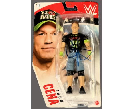 John Cena signed WWE Mattel vinyl model signature on original packaging. Good condition. All autographs come with a Certifica