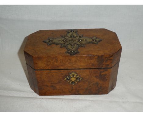 A Victorian brass mounted walnut rectangular tea caddy with fitted interior enclosed by a decorated hinged lid