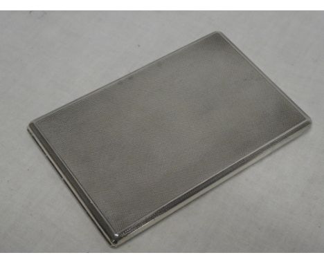 A good quality silver rectangular slide-opening cigarette case with engine turned decoration, London marks 1962