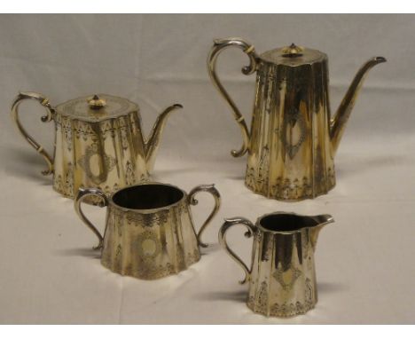 A good quality silver-plated four-piece tea and coffee set comprising tapered coffee pot with engraved decoration and scroll 