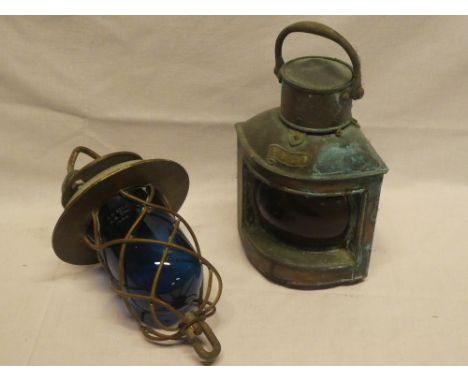 A brass hanging ship's pendant light with blue tinted glass lens and a small ship's copper port lantern (2)