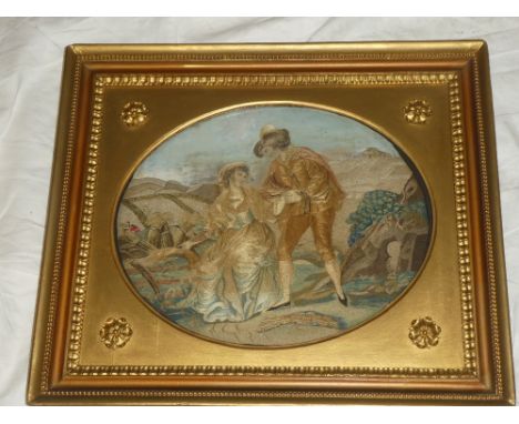 A George III embroidered silk-work oval panel depicting a male and female in a country clearing 12" x 15" oval in ornate gilt