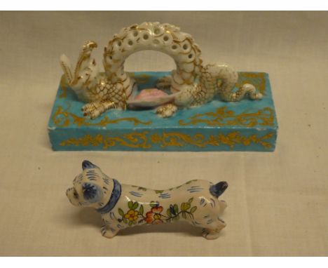 A good quality Continental porcelain table centre in the form of a dragon on rectangular base (af) and a French Quimper potte
