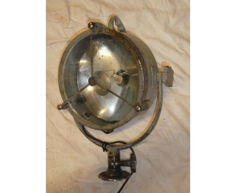 An old painted metal nautical-style search light with circular lens, 19" high overall