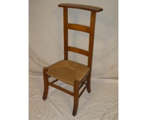 A Continental walnut ladder-back occasional prayer-style chair with rush-work seat on square legs