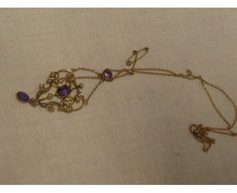 A 9ct gold mounted Art Nouveau pendant necklace set amethyst and seed pearls