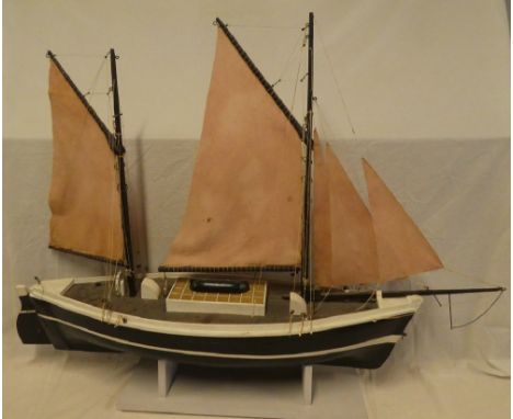 An old painted wood model boat based on a Looe lugger with linen sales and deck detail, 42" long overall