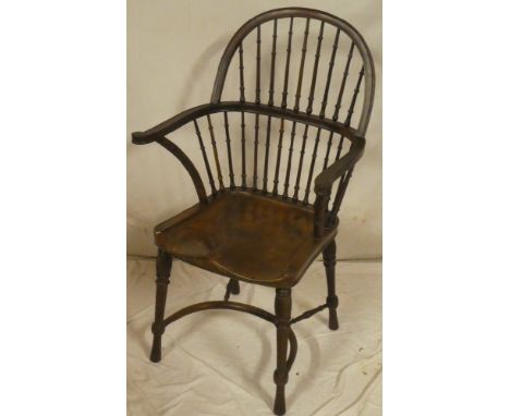 A good quality old mahogany and fruit wood Windsor-style chair with bobbin turned back and shaped feet on spiral and turned l