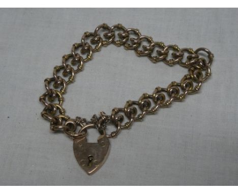 A 9ct gold chain link bracelet with 9ct padlock clasp