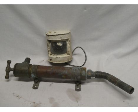 An old brass and copper nautical hand pump and a painted metal boat lamp (2)