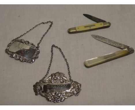 A George V silver bladed folding pocket knife with mother of pearl mounts, Sheffield marks 1913; silver brandy decanter label