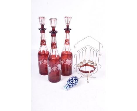 Decorative glasswareTo include three ruby flash glass decanter bottles, plate mounted ruby flash glass bowl and a Nailsea typ