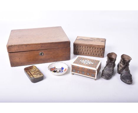 A mahogany writing slope early 20th Century
A wooden puzzle box with geometric inlaid decoration and inlaid decoration of Mt 