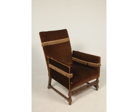 An unusual early 20th Century oak and upholstered reclining arm chair
The rectangular padded back with a reclining mechanism 