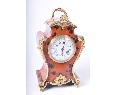A boulle style mantle clock mid to late 20th CenturyThe eight day clock with 9cm enamel dial with both Arabic and Roman numer