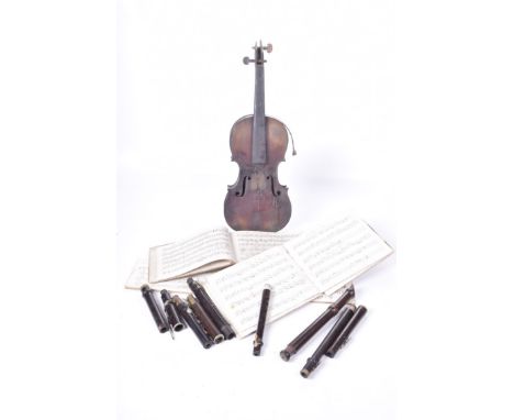 A collection of musical ephemera and instrumentsComprising a hand written music book dated 1823, part of a violin, single pie