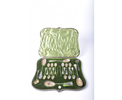 A Victorian silver and silver-gilt cased spoon serviceTo include; four berry spoons, twelve tea spoons, six with a shell bowl