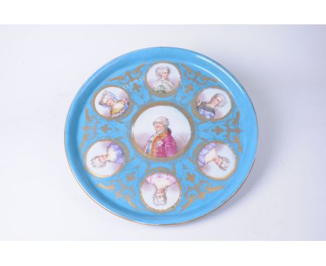 A French Sevres style charger, late 19th CenturyOf circular form, with swept upright rim, the bleu Celeste ground, adorned wi