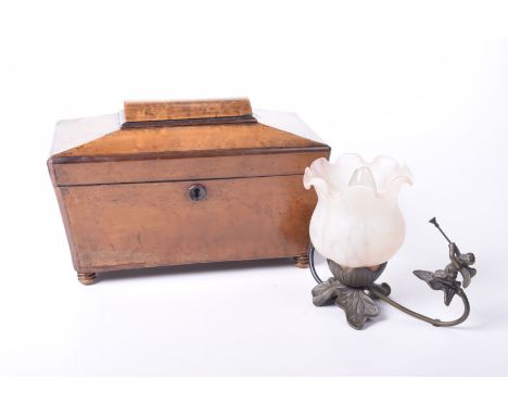 A sarcophagus shaped satin walnut tea caddy, mid 19th CenturyThe lift up lid to reveal three compartments, also a metal and g