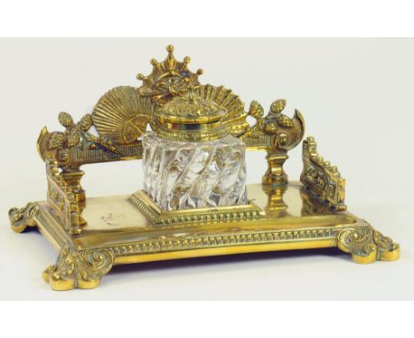 A VICTORIAN BRASS INKSTAND WITH BRASS MOUNTED GLASS INKWELL