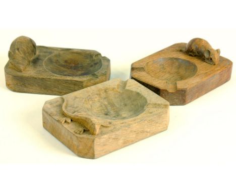 TWO MOUSEMAN CARVED OAK ASHTRAYS BY ROBERT THOMPSON OF KILBURN AND ANOTHER, CARVED WITH A REPTILE