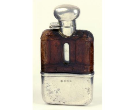 A GEORGE V SILVER MOUNTED GLASS HIP FLASK WITH CROCODILE HIDE COVERED SHOULDER, BIRMINGHAM 1931