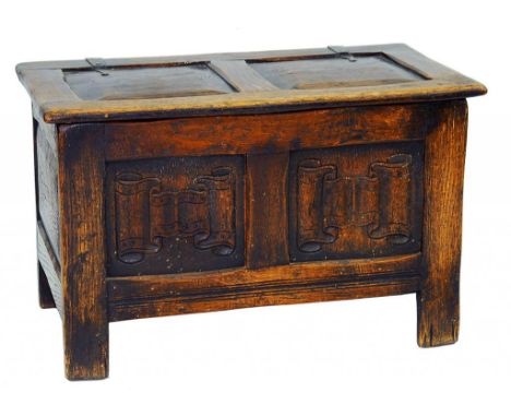 AN OAK DWARF TWIN PANEL CHEST WITH LINENFOLD PANELS TO THE FRONT