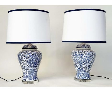 TABLE LAMPS, a pair, Chinese blue and white ceramic of lidded vase form, stylised foliage and lucite base, with shades, 80cm 