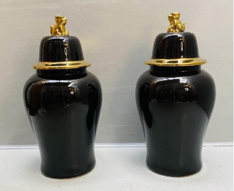 TEMPLE JARS WITH COVERS, 82cm high, 39cm diameter, black glazed ceramic, gilt detail. (2) 