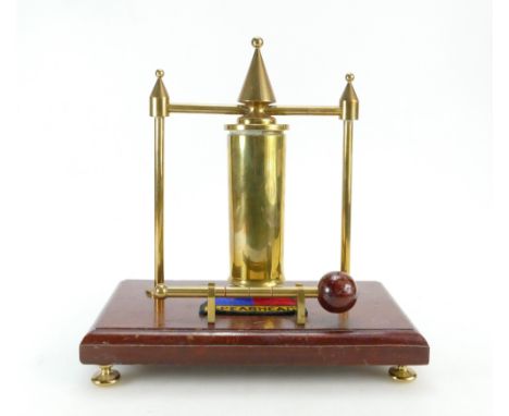 Trench Art brass dinner gong on wooden base with Spearhead patch, 28cm.