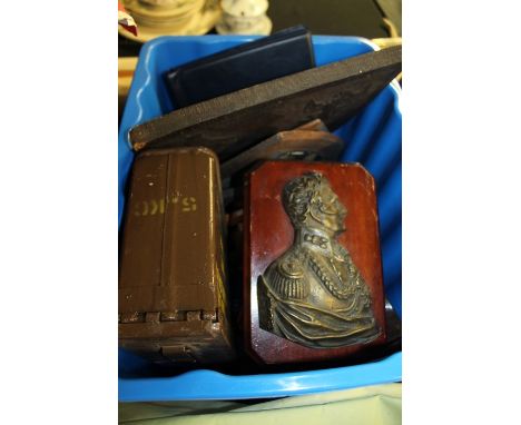 Collection of heraldic shields, cast metal profile plaque depicting Napoleon, 7.62mm ammunition tin (qty)