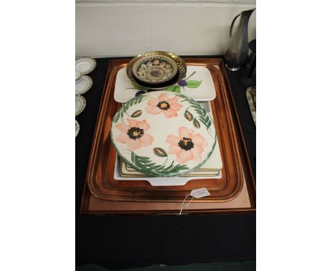 Collection of trays, to include a glazed needlework example, copper tray, Suzanne Katkhuda serving dish, two Italian ceramic 