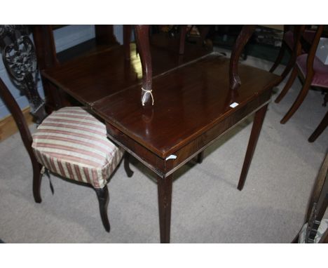 Edwardian mahogany card table, the rectangular frieze top raised on square tapering legs 76cm wide 