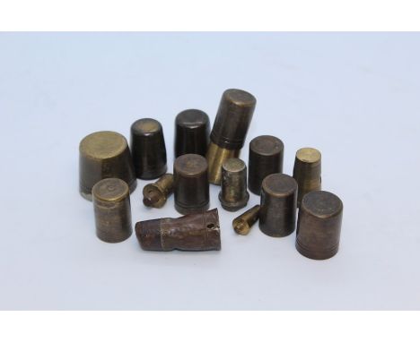 A collection of brass walking stick tips, (qty)