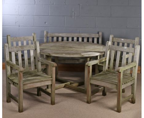 Teak circular topped garden table, together with four teak carver chairs (one bearing label for Barlow Tyrie) and a teak gard