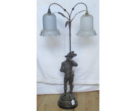 A 20th century spelter table lamp, depicting Don Juan with twin glass shades.