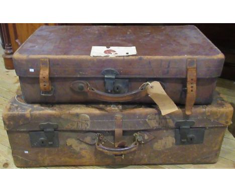 A set of three graduated full hide vintage suitcases.