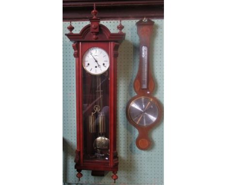 A reproduction mahogany Vienna wall clock, together with a reproduction aneroid banjo barometer.