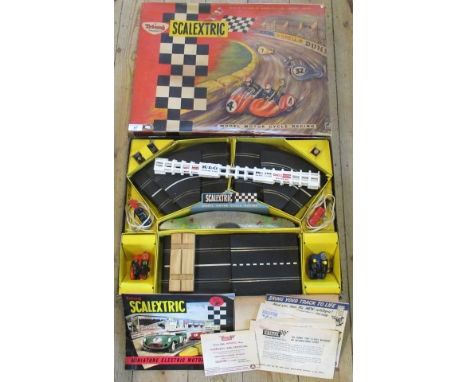 A Tri-ang Scalextric model Motorcycle Racing, comprising: track, fencing, hand controls and a pair of sidecars, in original b